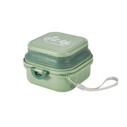 Green Dog Travel Folding Bowl in collapsed form with carrying strap, space-saving and ideal for outdoor pet feeding and hydration.